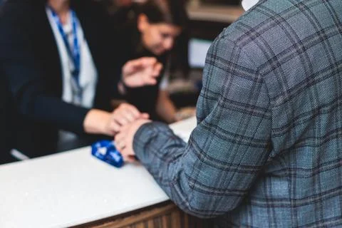 Process of checking in on a conference congress forum event, registration d.. Stock Photos