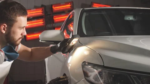 Process of checking quality of polishing of the car body. Stock Footage 100880795