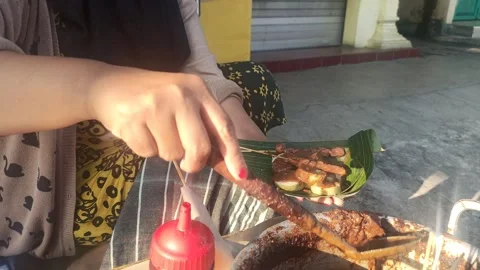 Process of chicken satay and lontong sprinkled with sweet peanut sauce Stock Footage 318851719