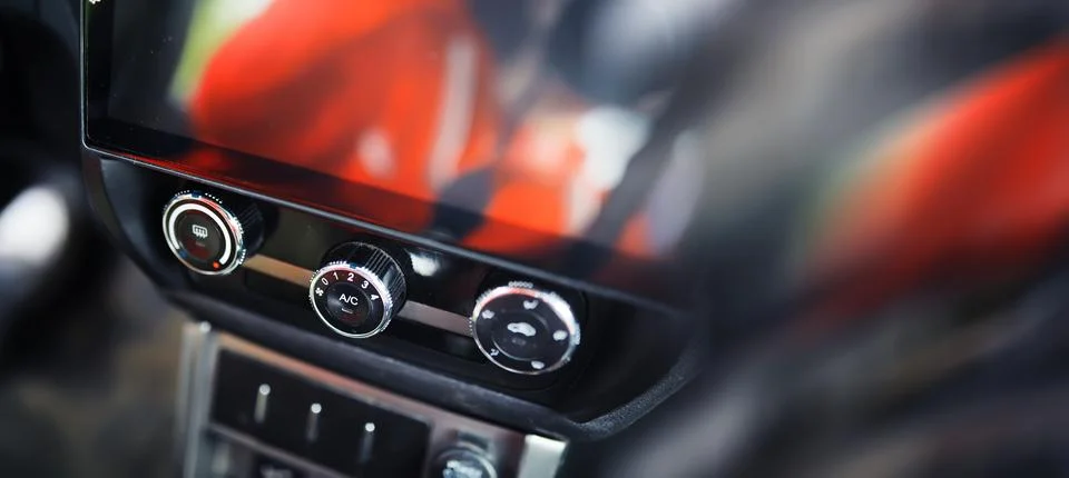 The process of choosing climate control in the car. Various controls in aut.. Stock Photos