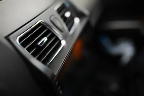 The process of choosing climate control in the car. Various controls in aut.. 스톡 사진