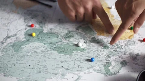 The process of choosing travel point on the map on a summer vacation a young Video stock 203003726