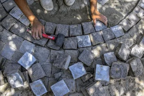 The process of circular laying of granite paving stones, top view Fotos Stock