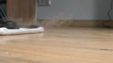 The process of cleaning and mopping the floor with a steam mop, close-up Stock Footage 241739725