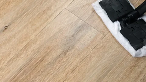 The process of cleaning and washing the floor with a steam mop, top view. The Stock Footage 242403503