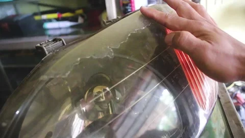 The process of cleaning the glass of car headlights Stock Footage 272772825