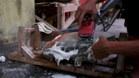 The process of cleaning the glass of car headlights Stock Footage 272841869