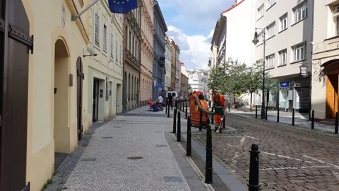 Process of cleaning streets with a janitor by industrial vacuum cleaner. Stock Footage 157357185