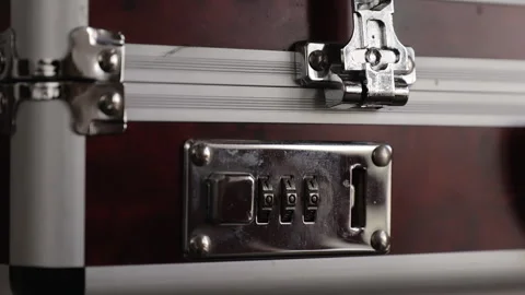 The process of closing the combination lock of metal suitcase, close-up Stock Footage 131314363