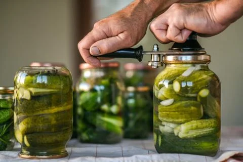 The process of closing salted cucumbers, preparation for the winter period Fotos Stock