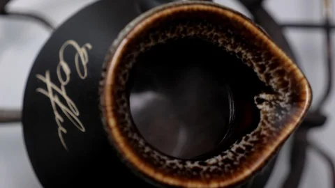 Process of coffee making int the turkish coffee maker cezve Stock Footage 128949091