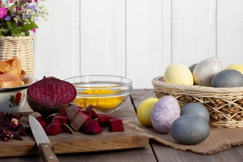Process of coloring Easter eggs with various food natural dyes. Preparing for Stock Photos