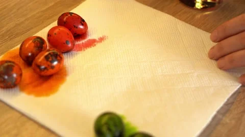 The process of coloring Easter quail eggs in different bright colors Stock Footage 157095227