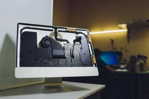 Process of computer repair. Engineer in white gloves disassembling computer. Stock Photos