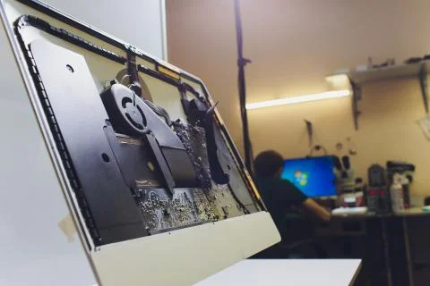 Process of computer repair. Engineer in white gloves disassembling computer. Stock Photos