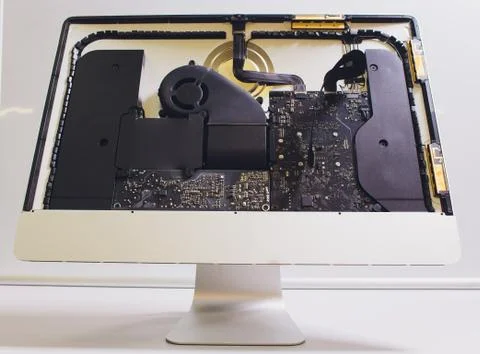 Process of computer repair. Engineer in white gloves disassembling computer. Stock Photos