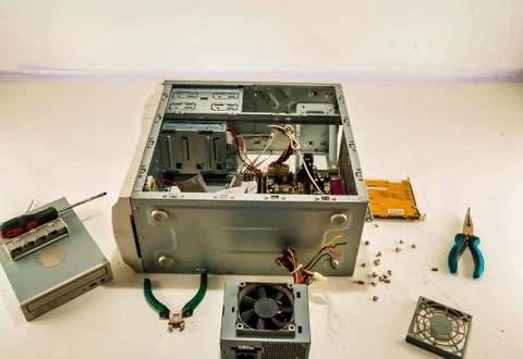 Process of computer repairing with a disassembled computer case Stock Photos