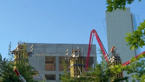 Process of concrete wall pouring at a construction site 스톡 동영상 276742063