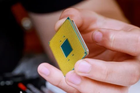 Process of connecting the CPU to the processor socket on a modern computer mo Stock Photos