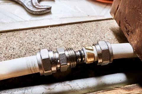 Process of connecting two ends of multilayer pipe with compression coupling.. 写真素材