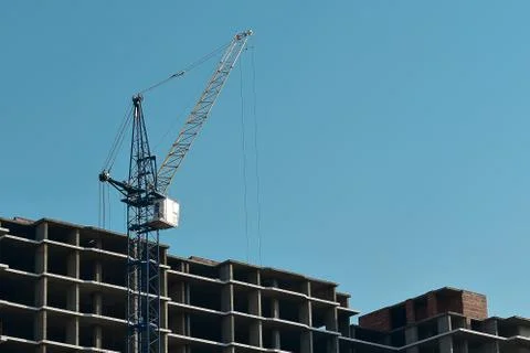 Process of construction high-rise building with crane Stock Photos