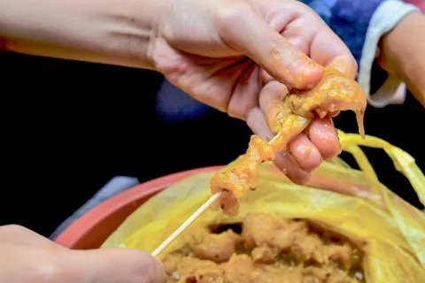 The process of cooking and making traditional food satay during Eid-Fitr Stock Photos