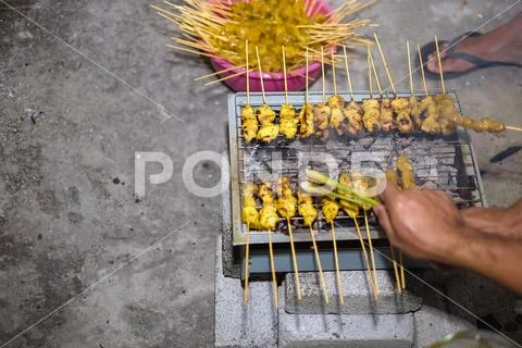 The process of cooking and making traditional food satay during Eid ...