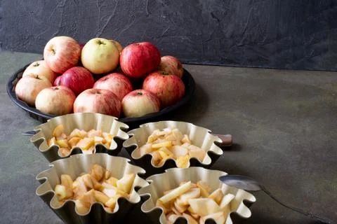 The process of cooking Apple pie Charlotte. Dough for apple pie before baking Stock Photos
