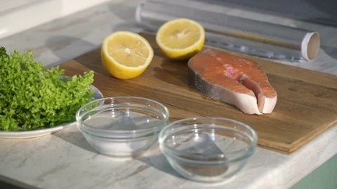 Process of cooking the baked salmon steak Stock Footage 105995319