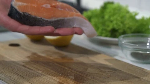 Process of cooking the baked salmon steak Stock Footage 105995685