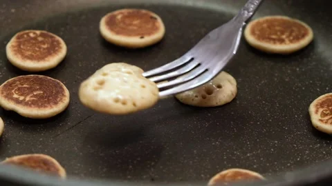Process of cooking baked tiny pancake cereal - trendy quarantine food. 動画素材 131106494