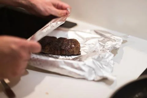 The process of cooking beef steak in a frying pan Stock-Fotos