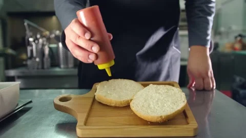 The process of cooking a Burger by a professional , all stages of making a juicy 動画素材 136411530