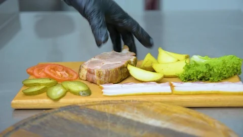 The process of cooking a burger with salad and piccul Stock Footage 101897449