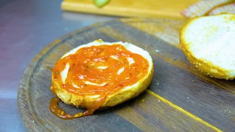 The process of cooking a burger with salad and piccul Stock Footage 101897510