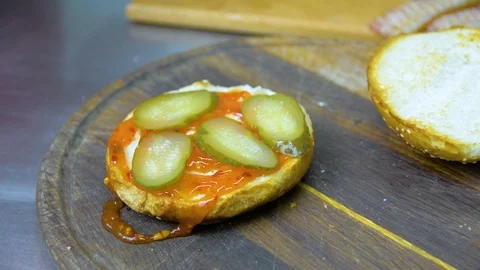 The process of cooking a burger with salad and piccul Stock Footage 101897532