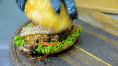 The process of cooking a burger with salad and piccul Stock Footage 101897558