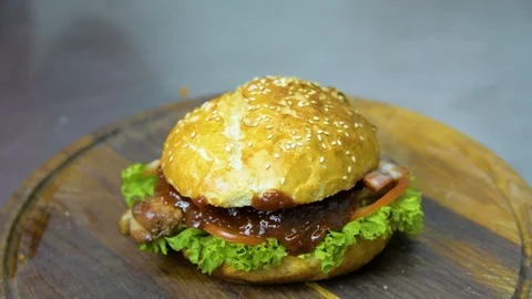 The process of cooking a burger with salad and piccul Stock Footage 101897569