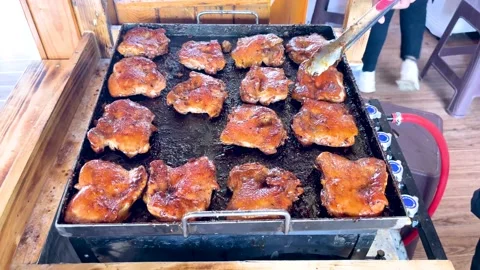 The process of cooking chicken steak on the grill Stock Footage 237478900