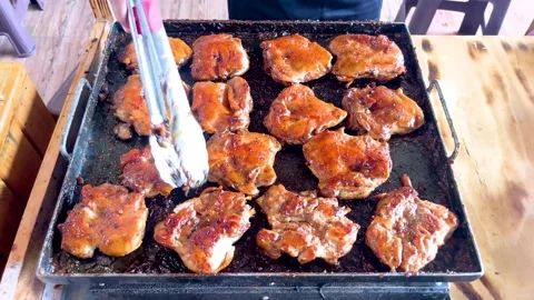 The process of cooking chicken steak on the grill Stock Footage 237478901