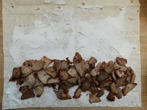 The process of cooking chicken wrap on kitchen table at home concept. Homemad Foto stock