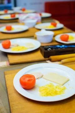 The process of cooking children's baskets of tomatoes and cheese Stock Photos