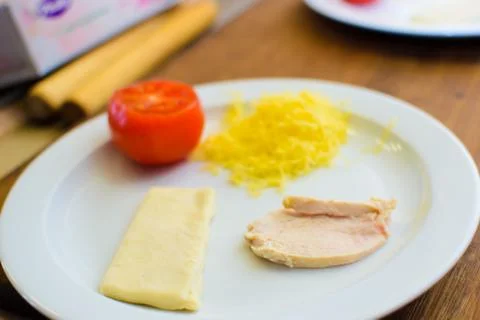 The process of cooking children's baskets of tomatoes and cheese 写真素材