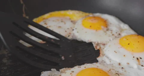 The process of cooking classic eggs in a pan. Stock Footage 167105480