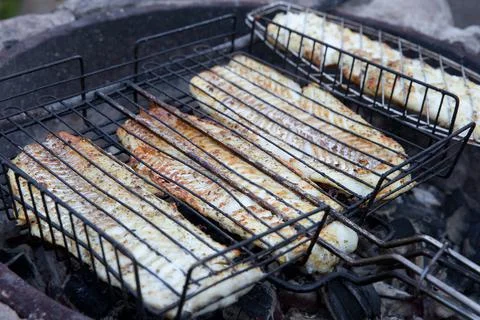 The process of cooking cod fillets on the grill Stock Photos