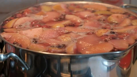 The process of cooking compote in a saucepan Stock Footage 239146612