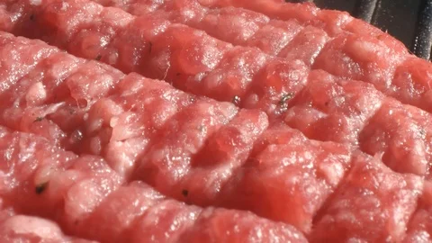 The process of cooking cutlet for a burger. The chef cooks a burger in the Video stock 115779025