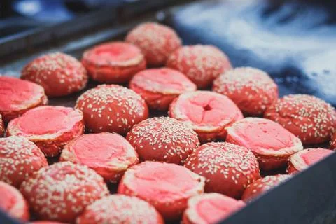 Process of cooking different multi colored burgers on open-air festival, view Stock Photos