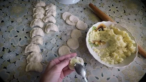 The process of cooking dumplings with potatoes by the hands of a housewife Stock Footage 97841104