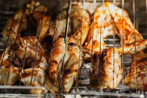 The process of cooking fish on the grill Stock Photos